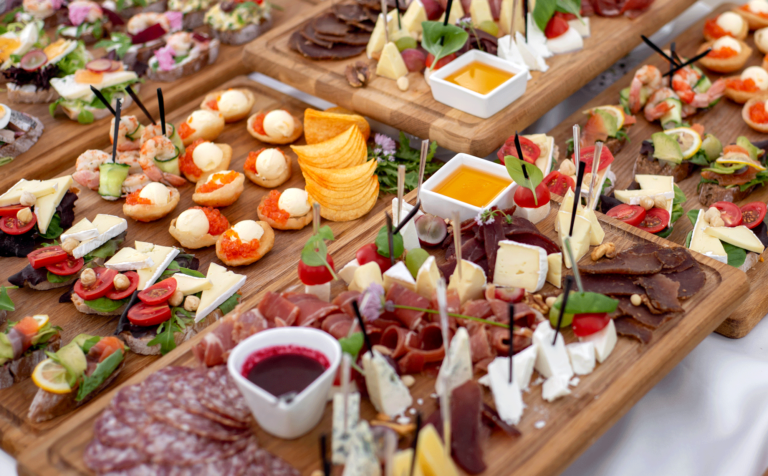 cheese and charcuterie appetizer boards with accompaniments